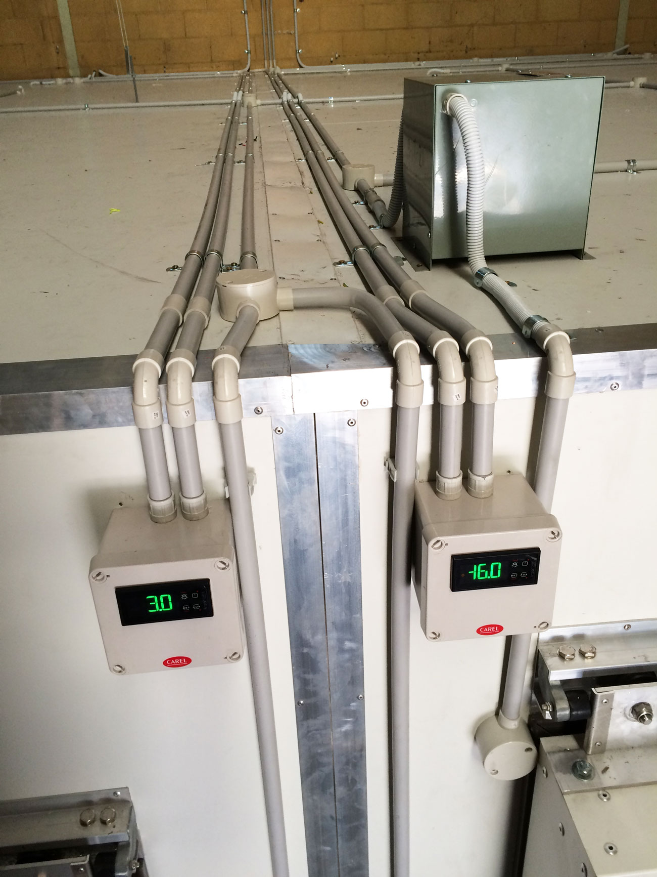 commercial refrigeration unit with temperature gauges